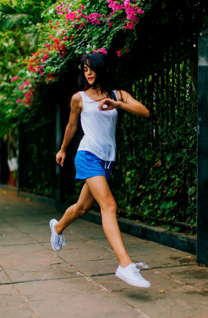 Woman running down the street 