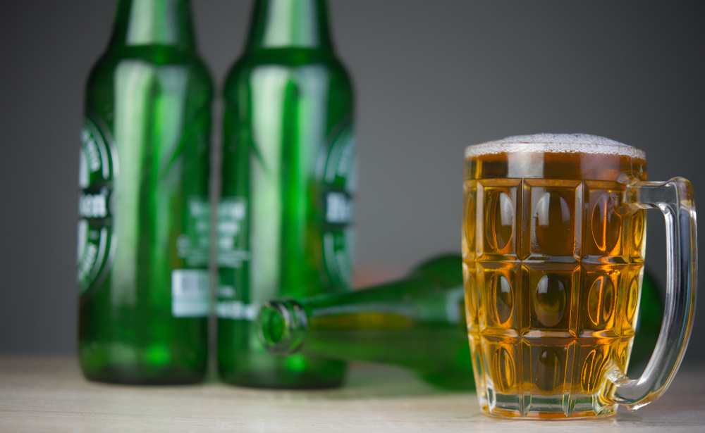 Bottles of Heineken Light, and a beer mug.