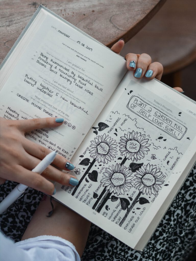 Woman writing on a journal.