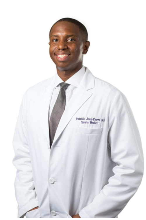 Dr. Patrick Jean-Pierre wearing his white doctor's coat.