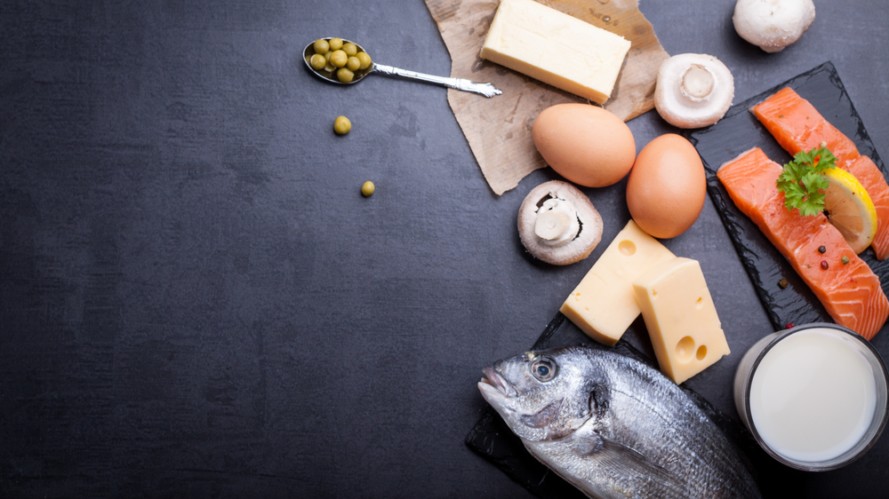 Black table with ingredients of food rich in vitamin D and omega 3,