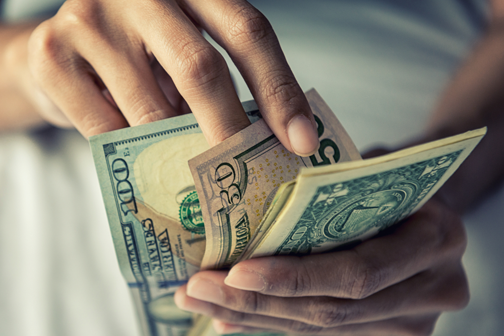 Close-up Hands counting money American dollars 