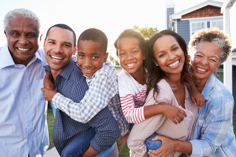 Portrait of a generation of happy family outdoors ready for trust & will estate planning.