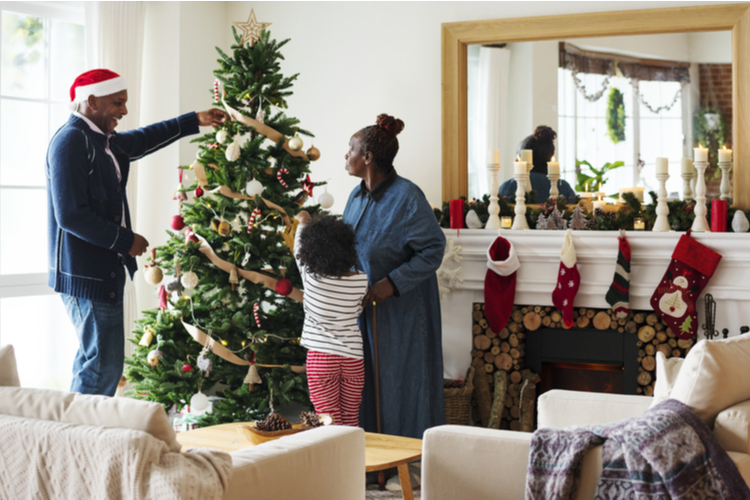 People Decorating Christmas Tree