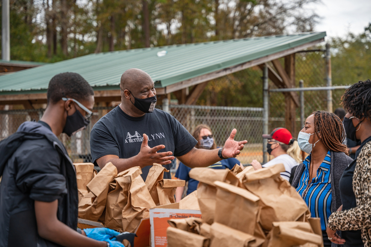 Scenes from the Collard Green Caucus food giveaway