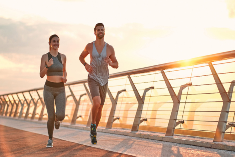 Couple doing sport together on the street. Morning run