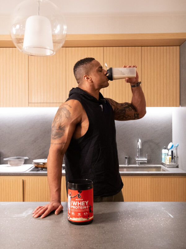 Corey drinking Six Star whey protein