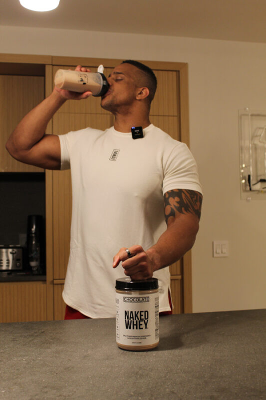 Corey drinking Naked Whey chocolate flavor