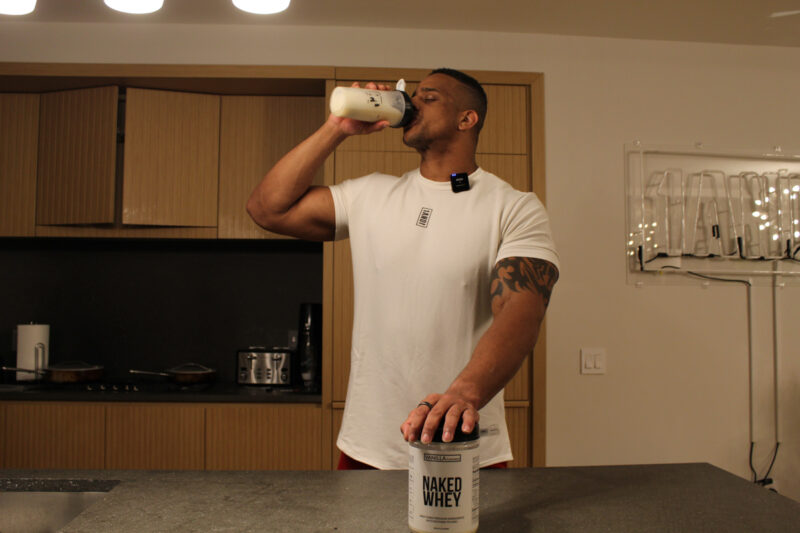 Corey drinking Naked Whey vanilla flavor